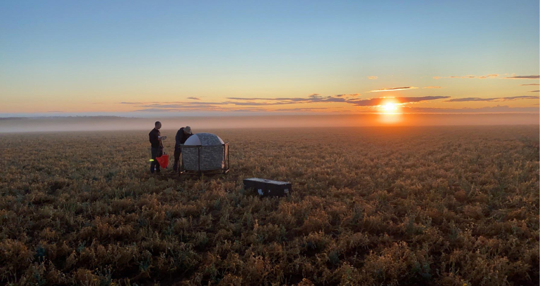 Two technicians at Koonibba Test Range at dawn