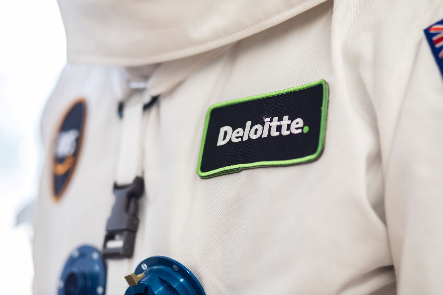 Deloitte patch on space suit