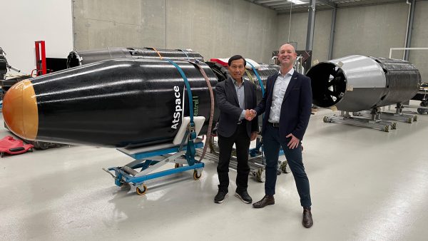 Dr. Yensen Chen and Lloyd Damp in front of a Kestrel I rocket