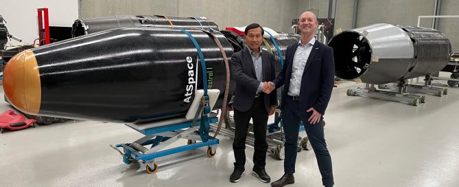 Dr. Yensen Chen and Lloyd Damp in front of a Kestrel I rocket