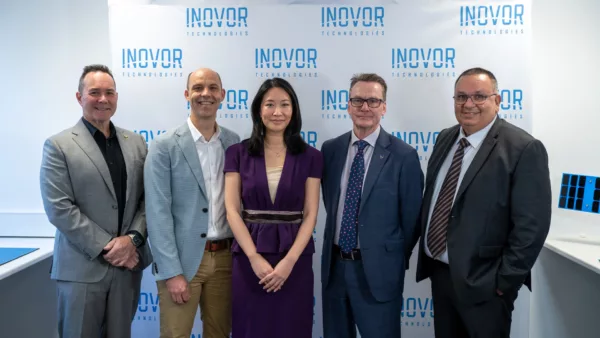 Group photo of five representatives from iLAuNCH TrailBlazer, Inovor Technologies, HEO, Optus, and Defence Science and Technology Group at the Project SWIFT partnership announcement.