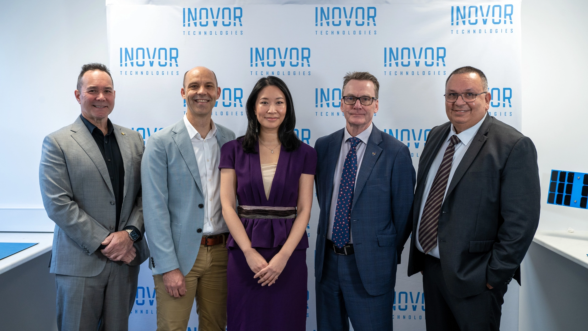 Group photo of five representatives from iLAuNCH TrailBlazer, Inovor Technologies, HEO, Optus, and Defence Science and Technology Group at the Project SWIFT partnership announcement.