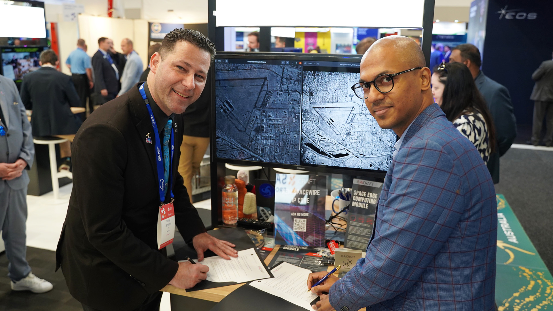 AICRAFT and TakeMe2Space Sign MoU at IAC Sydney AICRAFT and TakeMe2Space representatives signing MoU at IAC Sydney event.