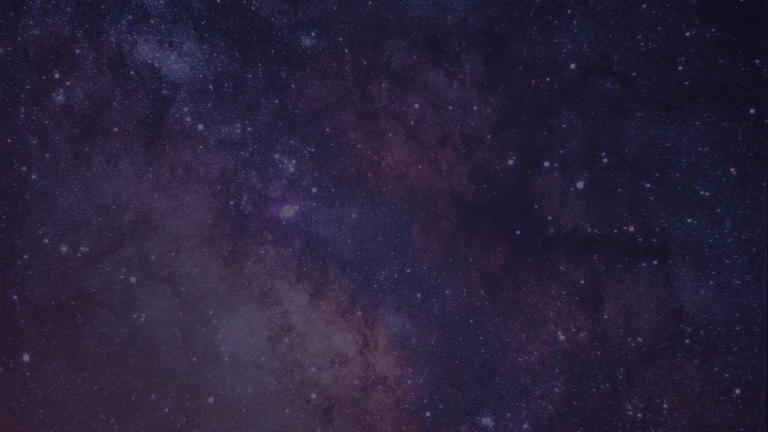 Purple and pink clouds and nebulae, surrounded by stars