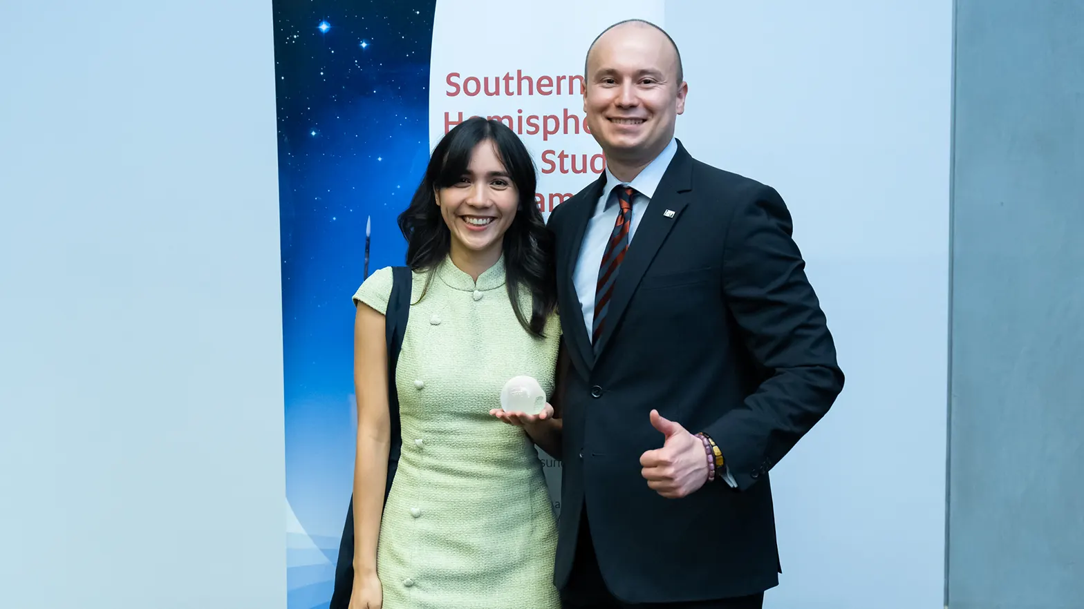 Tash receives her SHSSP 2025 Academic Award from Claudiu Mihai Tăiatu, Academic Director, International Space University.