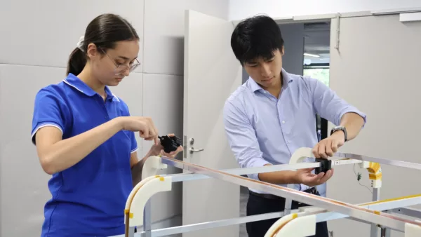 Sabine Molloy and Linh Co Bui of Inovor Technologies conducting initial design and testing of the Helmholtz Cage