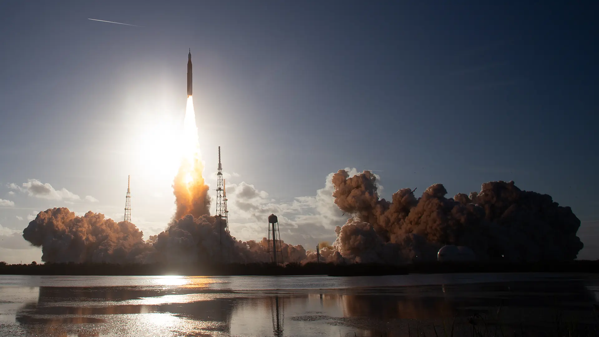 Artemis-II-Launch-NASA Rocket launching against a blue skyline.