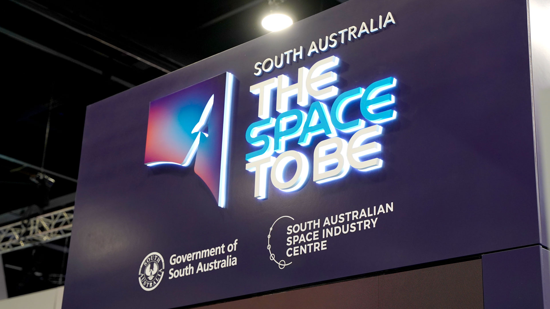 Space-To-Be-Signage South Australia The Space To Be signage on a dark blue background with Government logos underneath