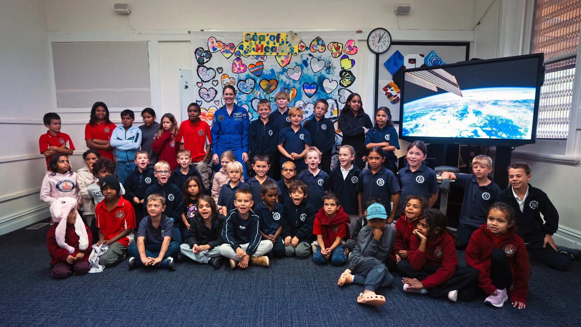 SASIC Regional Engagement Program Australian astronaut standing with a group of students